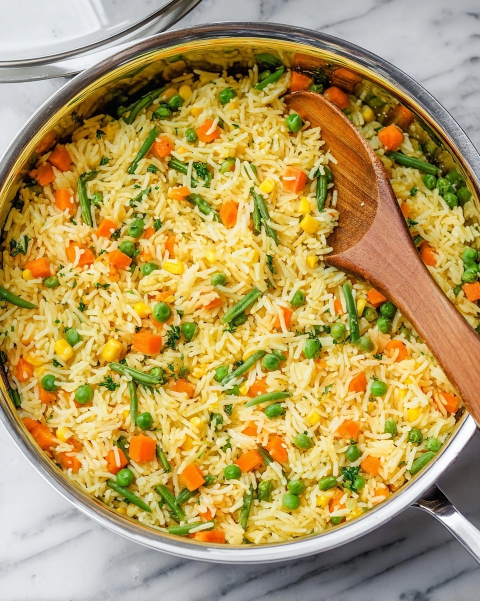 A large metal pan filled with cooked yellow rice mixed evenly with small green peas, chopped orange carrots, green beans pieces, and yellow corn kernels; a wooden spoon is partially submerged in the rice on the left side with its handle resting on the pan; the pan lid is slightly open and resting on the right side; the setting is on a white marbled surface. photo taken with an iphone --ar 4:5 --v 7