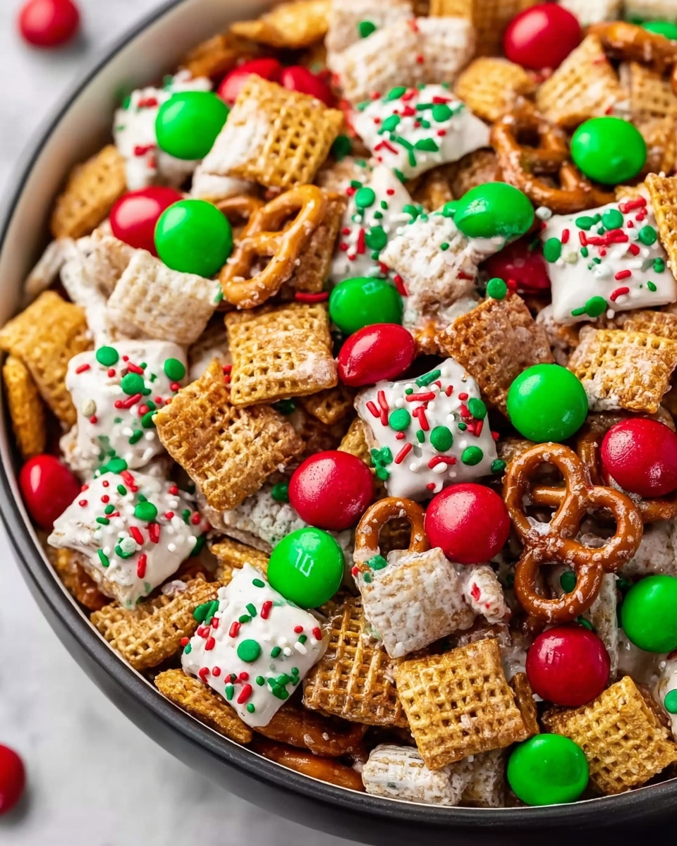 A close-up view of a bowl filled with a festive snack mix showing multiple layers of ingredients. The base layer consists of golden brown square cereal pieces with a rough texture. Scattered throughout are clusters of pretzels coated in white chocolate, decorated with small red, green, and white round sprinkles on top. Bright red and green candy-coated chocolates are spread evenly across the mix, adding a smooth and shiny texture. The bowl holding the snack mix is white and sits against a white marbled texture background. photo taken with an iphone --ar 4:5 --v 7